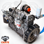 Cummins 6BT complete excavator engine, rear three-quarter view showing flywheel, injection pump and filters.